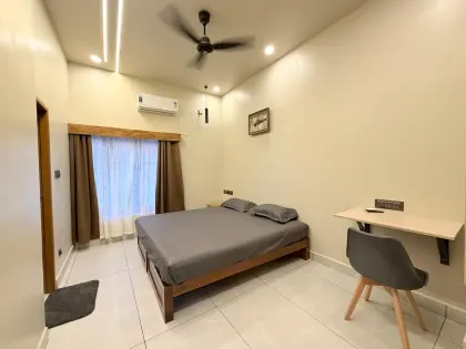 A bedroom at The Verandah, Punalur, with an attached bathroom